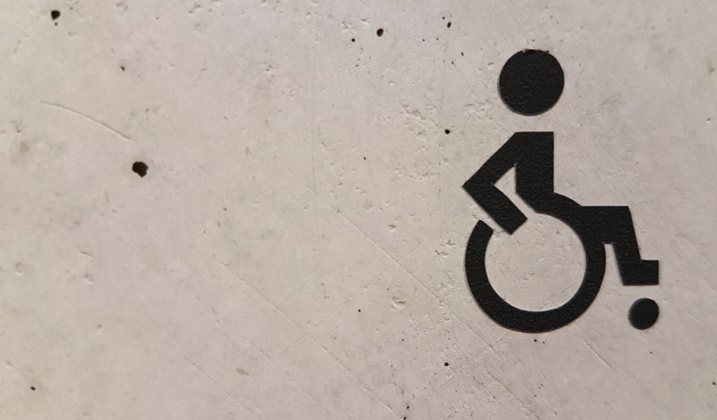 wheelchair users symbol on white wall